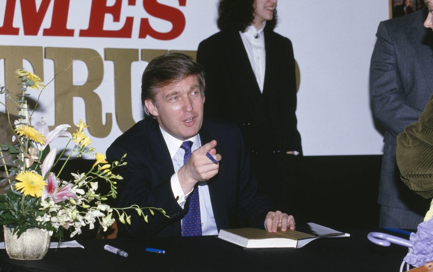 Donald Trump, signing his book