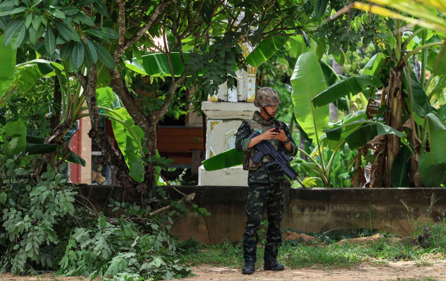 A Thai soldier stands guard amid the escalation of the Thailand-Cambodia dispute in Surin Province, Thailand on July 25, 2025.