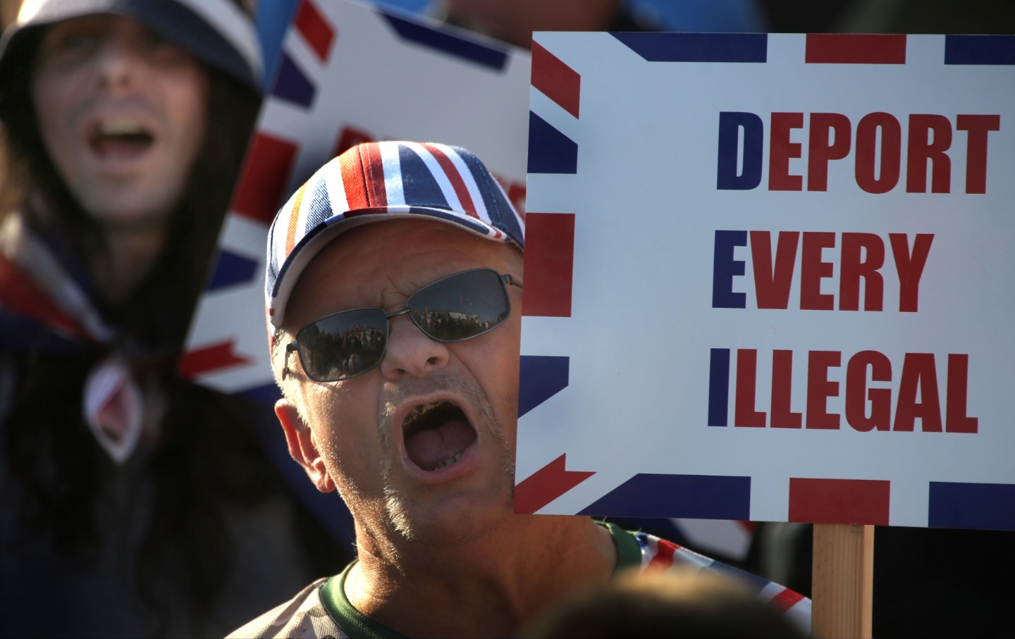 A protester against the asylum seekers being housed in the Brook Hotel holds a sign saying “Deport Every Illegal” during the demonstration on August 8, 2025, in Norwich, United Kingdom.