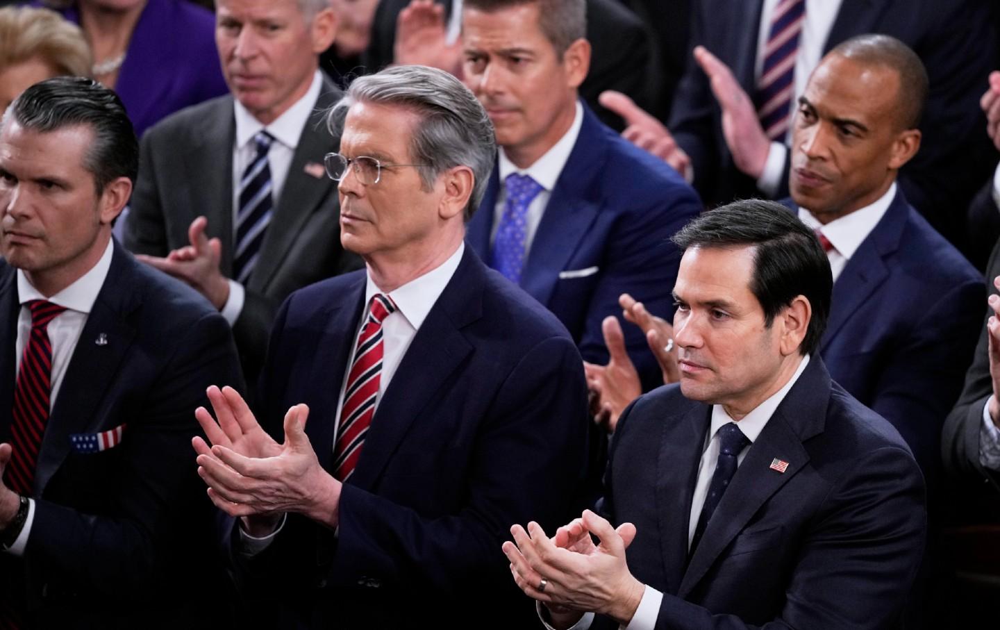 Secretary of State Marco Rubio, right, and other cabinet members, applaud President Donald Trump’s remarks about peace with Russia at a joint session of Congress at the Capitol in Washington, Tuesday, March 4, 2025.