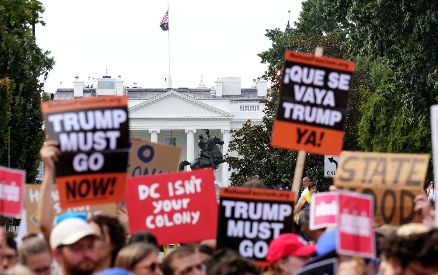 People participate in a rally against the Trump administration’s federal takeover of the District of Columbia on August 11, 2025, in Washington, DC.